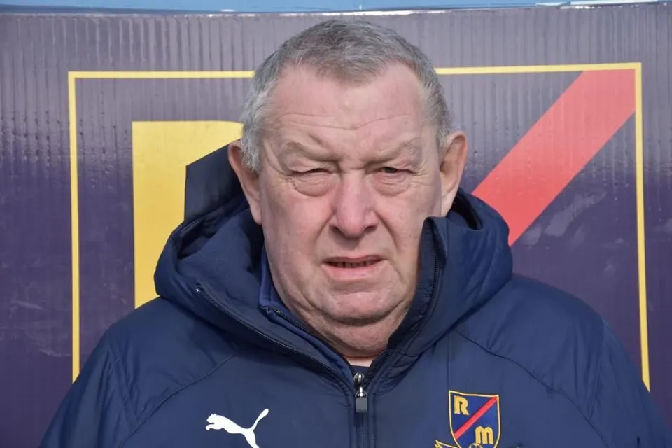 Timmy in Rosemount Mulvey puffer jacket. He has grey short back and sides and is clean shaven.